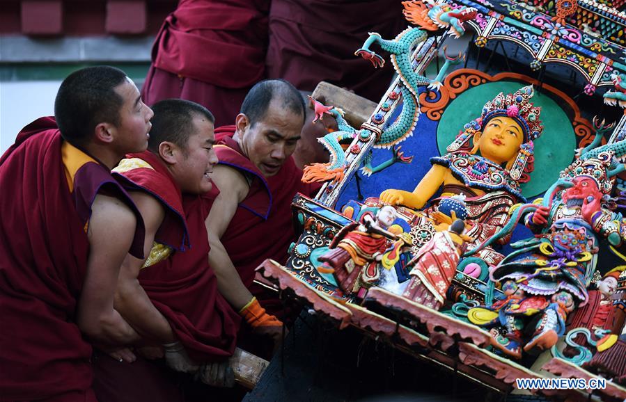 Butter sculptures of Buddha figurines exhibited at Taer Monastery