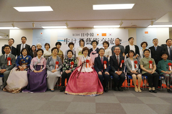 China, Japan and South Korea artists arrange flowers in summer