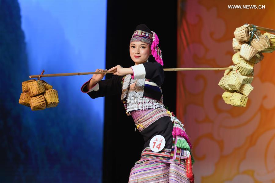 Final competition of ethnic dress festival held in SW China's Yunnan