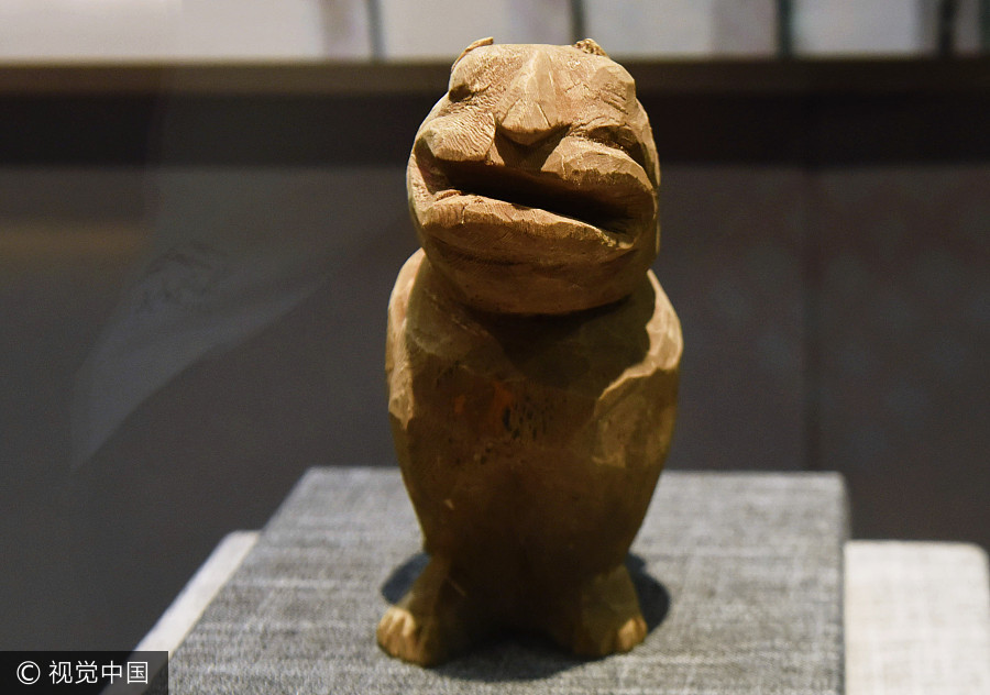 Cute carved artifacts on display in E China