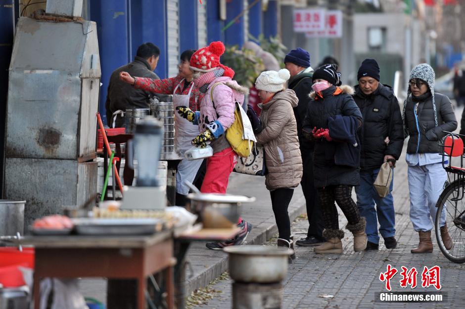 中国多地大风降温 京城迎入冬最冷一天