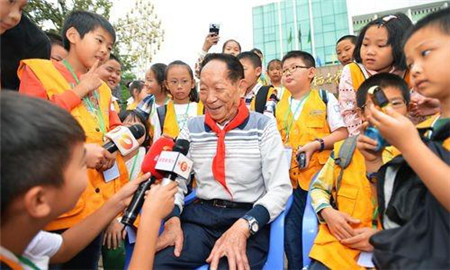 Father of Hybrid Rice celebrating World Food Day with little reporters