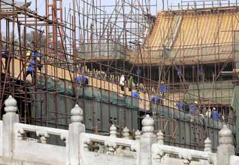 Forbidden City renovation:Workers renovate palaces in the 600-year-old Forbidden City, once home to Chinese emperors, in Beijing yesterday. China spent nearly 1.05 billion yuan (US$126.5 million), in which the central government invested 680 million yuan (US$82 million) in 2003 for the protection of its cultural relics, numbering almost 400,000 registered unmovable cultural pieces and about 12.6 million movable relics stored in State-owned museums throughout the country. 