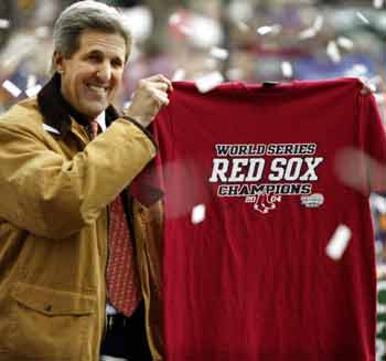 Democratic presidential nominee John Kerry holds up a Boston Red Sox tee-shirt, given to him by Red Sox team executives, at a campaign rally in Manchester, New Hampshire October 31, 2004. Kerry and President George W. Bush began a tense sprint to the finish Sunday in a deadlocked race for the White House, hunting for every last vote in the crucial showdown states of Ohio and Florida. [Reuters]