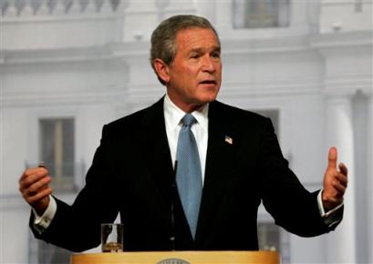 U.S. President Bush answers questions during a joint news conference with Chilean President Ricardo Lagos at La Moneda palace in Santiago, Chile, Sunday, Nov. 21, 2004. [AP]