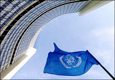 AEA flag flatters in the wind in front of the International Atomic Energy Agency headquarers in UN city in Vienna. Iran pledged it was still committed to suspending parts of its sensitive nuclear activities as of Monday and that alarm over its last minute uranium comversion activities was merely US 'propaganda'. [AFP/file]