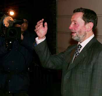 Britain's David Blunkett leaves his home following his resignation as Home Secretary in London, December 15, 2004. [Reuters]
