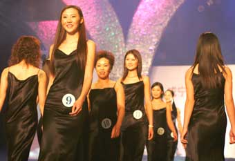 China's winner of Miss Artificial Beauty, Feng Qian (2nd-L), and other contestants parade down the catwalk at the pageant in Beijing December 18, 2004. China chose its first Miss Artificial Beauty on Saturday, giving the crown to a 22-year-old from the northeastern city of Jilin who couldn't have done it without the help of her plastic surgeon.