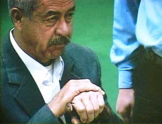 A video grab shows Saddam Hussein's cousin and feared lieutenant Ali Hassan al-Majid, known as "Chemical Ali" appearing before an investigating magistrate in an undisclosed location, December 18, 2004. The hearings, promised by the interim government as it began campaigning for the first post-Saddam election, were the first of a new stage in the trial process that will press war crimes and other charges against Saddam and 11 others, officials said. [Reuters]