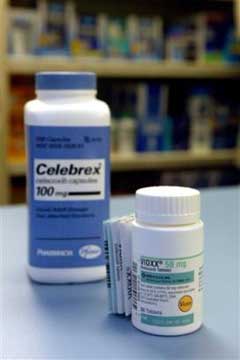 A bottle of Vioxx, right, is photographed next to a bottle Pfizer's Celebrex at a pharmacy in New York Sept. 30, 2004. Pfizer Inc. said Friday, Dec. 17, 2004, it has found an increased risk of heart problems with patients taking its painkiller Celebrex, a drug that is in the same class as the Vioxx, which was pulled from the market in September because of safety concerns. (AP 