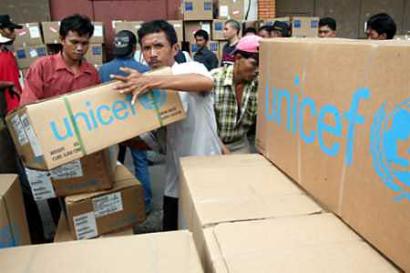 Indonesian workers at Sukarno-Hatta airport in Jakarta load UNICEF (news - web sites) boxes containing aid supplies into a truck headed for tsunami-hit Aceh province December 31, 2004. Asia's tsunami death toll soared above 125,000 on Friday as millions struggled to find food and clean water and the world mobilized for what is shaping up to be the biggest relief effort in history. (Dadang Tri/Reuters) 