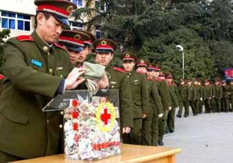 Students and officers of the Electronic Engineering Institute of the People's Liberation Army make donations in Hefei in east China's Anhui province January 4, 2005 to the tsunami-hit countries in Asia. The Anhui Red Cross called on residents of the province to offer a helping hand to the tsunami survivors in South and Southeast Asia, China state media reported. [newsphoto]