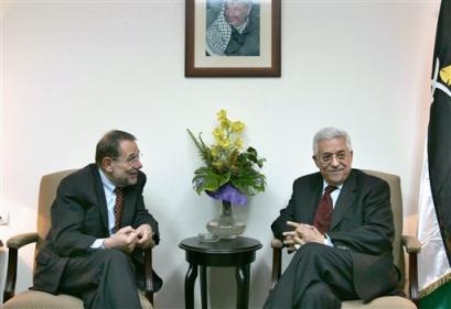 Palestinian Authority President-elect Mahmoud Abbas also known as Abu Mazen, right, meets with EU foreign policy chief Javier Solana the morning after his election victory Monday, Jan. 10, 2005 in the West Bank town of Ramallah. Abbas swept the polls with an estimated 70% of the vote to replace the late Palestinian leader Yasser Arafat. [AP]