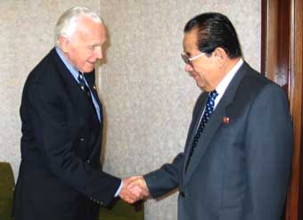 Senior U.S. congressman Tom Lantos (L), seen in a picture handed out by his office, shakes hands with North Korea's Foreign Minister Paek Nam-sun during a meeting in Pyongyang January 10, 2005. Lantos had wide-ranging talks with North Korean leaders including "nuclear matters", amid concern about stalled six-party talks on the North's nuclear weapons programme.