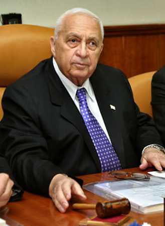 Israeli Prime Minister Ariel Sharon opens his first cabinet meeting of the new coalition government in Jerusalem January 11, 2005. Palestinian militants resumed rocket and mortar fire at Jewish settlements in Gaza on Tuesday, throwing down the gauntlet to newly elected Palestinian leader Mahmoud Abbas and his call for calm to talk peace with Israel. [Reuters]
