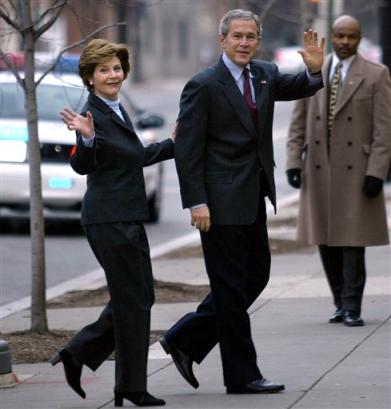 US President Bush and his wife, Laura, enter St. John's Church, Sunday, Jan. 16, 2005, in Washington. President Bush says voters have ratified his policies in Iraq by saying 'The American people listened to different assessments made about what was taking place in Iraq, and they looked at the two candidates, and chose me.' [AP]
