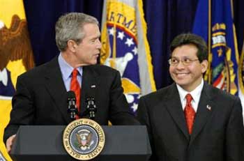 US President Bush speaks of his confidence in his newly appointed attorney general Alberto Gonzales during a swearing in ceremony at the Justice Department in Washington, Monday, Feb. 14, 2005. Bush also urged Congress to reauthorize the USA Patriot Act, the administration's widely criticized anti-terrorism law. [AP]