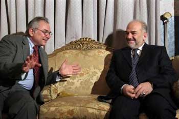 Ibrahim al-Jaafari, interim vice president and the main face of the Islamic Dawa Party, who is now almost certainly the winning Shiite ticket's candidate as Iraq's next prime minister, right, meets with the U.N. Secretary-General's top envoy to Iraq, Ashraf Qazi of Pakistan, after an interview with the Associated Press in Baghdad, Iraq Tuesday, Feb. 15, 2005. [AP]