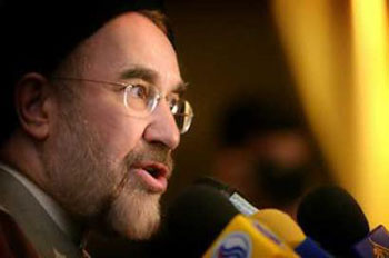Iranian President Mohammad Khatami speaks with media during a news conference at Tehran's Saadabad Palace, February 23, 2005. US President Bush should be aware that the United States would pay a heavier price than Iran if it tried to encroach on the Islamic state's independence, Khatami said. [Reuters]