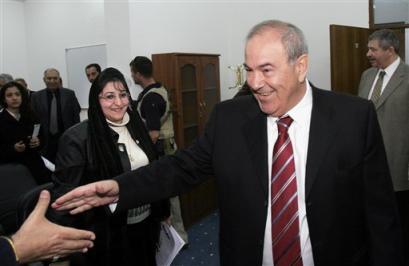 Iraqi Interim Prime Minister Ayad Allawi, right, greets supporters after a press conference at the headquarters of his Iraqi National Accord party in central Baghdad, Iraq (news - web sites) Wednesday, Feb. 23, 2005. (AP Photo/Khalid Mohammed) 