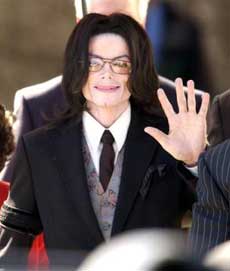 Michael Jackson waves to his supporters as he leaves the Santa Barbara County Courthouse in Santa Maria, Calif., Monday, March 7, 2005, following the sixth day in Jackson's trial on charges of child molestation. [AP] 