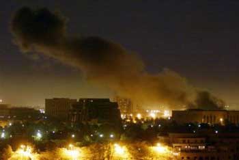 Smoke bellows from a large explosion that rocked Baghdad, Iraq during air raids in this March 31, 2003 file photo. [AP]