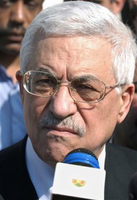 Palestinian Authority President Mahmoud Abbas, also known as Abu Mazen, talks to reporters after arriving at his house in the West Bank city of Ramallah Friday, March 18, 2005. Returning to Ramallah Friday from talks with the militant groups in Cairo, where they agreed Thursday to continue a truce with Israel until the end of this year. [AP]