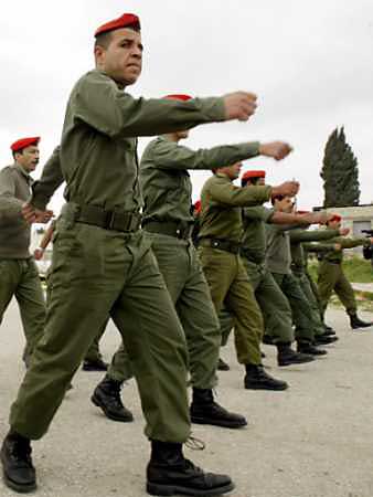 Palestinian security forces participate in a training session, as part of preparations for Israel's handover of the West Bank city of Tulkarm March 21, 2005. Israel agreed to give security control of Tulkarm to Palestinians after both sides ended a dispute that had delayed the handover, Israel Radio said. [Reuters]
