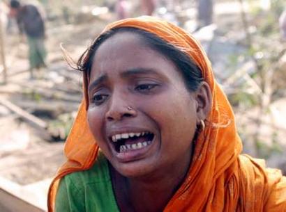 A woman 
 cries as she mourns the loss of her son who died in a storm at a village in the northern Bangladeshi district of Gaibandha, 300 km (200 miles) from the capital Dhaka, March 21 ,2005.