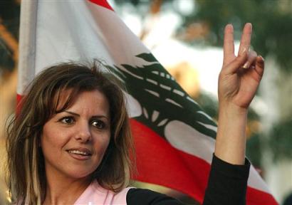 A Lebanese flashes a victory sign during a pro-opposition demonstration in Beirut, Lebanon, on Monday, March 28, 2005. Syria has withdrawn 2,000 more troops from Lebanon, a military official said, bringing Damascus' military presence in the country to the lowest level since it began three decades ago. (AP Photo/Petros Karadjias) 