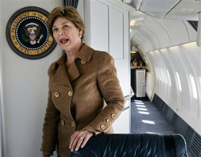 U.S. first lady Laura Bush speaks to reporters on board her plane en route to Kabul, Afghanistan, Tuesday, March 29, 2005. Laura Bush says she has been waiting a long time to tell the women of Afghanistan that American women stand with them. (AP Photo/Charles Dharapak)