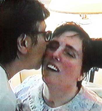 Terri Schiavo, right, gets a kiss from her mother, Mary Schindler, in this Aug. 11, 2001, file image taken a from videotape and released by the Schindler family Oct. 14, 2003, in Pinellas Park, Fla. Terri Schiavo, the severely brain-damaged woman whose 15 years connected to a feeding tube sparked an epic legal battle that went all the way to the White House and Congress, died Thursday, 13 days after the tube was removed, her husband's attorney said. She was 41. (AP