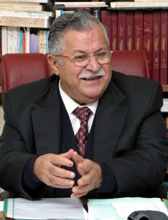Jalal Talabani speaks to a reporter during an interview held in his office in the Kurdish city of Arbil in this February 13, 2005 file photo. Veteran Kurdish leader Jalal Talabani will be named Iraq's new president at a parliament meeting on April 6, 2005, senior government sources said. They said the two vice presidents would be Adel Abdul Mahdi, a Shi'ite politician who is currently finance minister, and outgoing President Ghazi Yawar, a Sunni Arab. REUTERS/Namir Noor-Eldeen/Files 