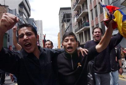 Protesters march near the Congress Building during a protest against the Government of President Lucio Gutierrez in Quito, Ecuador,Wednesday, April 6, 2005. (AP