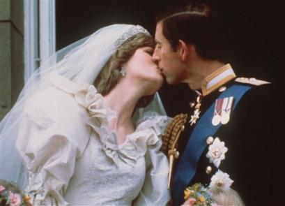 Britain's Prince Charles kisses his bride, the former Diana Spencer, on the balcony of Buckingham Palace in London after their wedding on July 29, 1981. Prince Charles' first wedding drew royalty and heads of state to St. Paul's Cathedral, a million well-wishers in the streets of London and a global television audience of some 700 million. The modest civil union of the prince and Camilla Parker Bowles next Friday April 8, 2005, makes a poignant contrast to the fairy-tale trappings of his 1981 wedding, as not even his mother the Queen will show up for his second ceremony. (AP Photo)