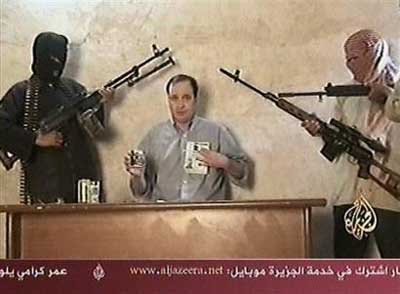 This TV image taken from footage broadcast by the Al Jazeera satellite channel on Wednesday April 13, 2005 which it says shows an American who had been kidnapped in Iraq two days before. The US embassy said the man on the video appeared to be the same American contract worker kidnapped from the Baghdad area on Sunday. A spokesman for the embassy said the man's name was Jeffrey Ake, but gave no further details. No group has claimed responsibility for the abduction. (AP 