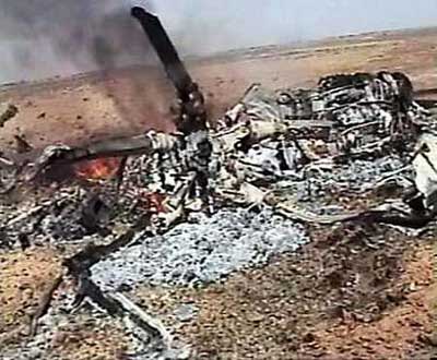 A video grab shows the wreckage of a Russian-built commercial helicopter in Baghdad, April 21, 2005. An Iraqi insurgent group said it shot down a commercial helicopter with 11 people on board and then killed the only survivor, according to a statement and video posted on the Internet. 