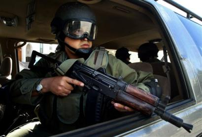 A Palestinian police officer guards in front of the residence of Palestinian Authority President Mahmoud Abbas, also known as Abu Mazen, in Gaza City, Sunday, April 24, 2005. On Saturday, Palestinian Authority President Mahmoud Abbas appointed Brig. Gen. Alaa Husni and two other security chiefs in a major step toward internal reform long demanded by the United States. (AP