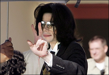 Pop icon Michael Jackson waves to his fans as he arrives to attend his child molestation trial. Jackson was a spendaholic mired in debt, jurors in his child sex trial heard, as prosecutors pushed a financial motive for the star's alleged plot to abduct his young accuser.(AFP
