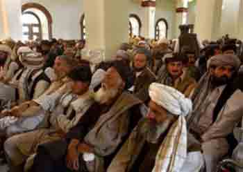 Afghan members of the Loya Jirga, traditional grand assembly, gather to meet with Afghan President Hamid Karzai at the presidential palace in Kabul, Afghanistan on Sunday, May 8, 2005. Hundreds of tribal leaders on Sunday backed President Hamid Karzai's plans for a 'strategic partnership' with the United States, a government spokesman said, a pact which could cement a long-term American military presence in Central Asia. (AP 