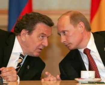 Russian President Vladimir Putin (R) and German Chancellor Gerhard Schroeder talk during a meeting in Moscow, May 9, 2005. 