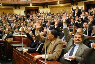 Members Egypt's parliament vote with a show of hands during their session Tuesday May 10, 2005 in Cairo Tuesday May 10, 2005 in Cairo, after they discuss a controversial constitutional amendment which changes the rules of presidential elections from simple referendum system of 'yes' or 'no' vote to mutli-candidate elections.