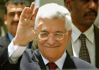 Palestinian Authority President Mahmoud Abbas, also known as Abu Mazen waves after a meeting in the West Bank city of Ramallah, Monday, May 23, 2005.