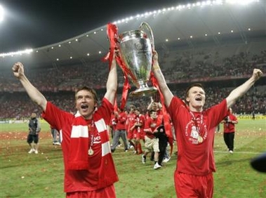 Liverpool's Vladimir Smicer, left, and John Arne Riise hold the trophy aloft after the UEFA Champions League Final between AC Milan and Liverpool at the Ataturk Olympic Stadium in Turkey, Istanbul Wednesday May 25, 2005. Liverpool won 3-2 on penalties after the match finished 3-3 after extra time. (AP 