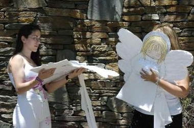 Supporters of Michael Jackson place angel figures on the gate at the entrance to his Neverland Ranch in Los Olivos, California June 3, 2005.