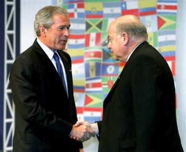 U.S. President Bush, left, shakes hands with Organization of American States (OAS) Secretary General Jose Miguel Insulza after speaking at the OAS General Assembly in Fort Lauderdale, Fla., Monday, June 6, 2005. (AP 