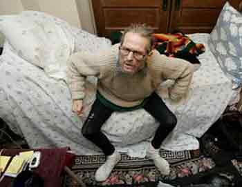 Cancer patient Christopher Campbell sits on the side of his bed in his home Monday, June 6, 2005, in Portland, Ore. Campbell who has a medical marijuana card, said he will not cease using the drug to quell his pain and improve his appetite. 'It's not going to stop me, that's for sure,' said Campbell, 58, who suffers from lymphoma and has had his spleen, and portions of his pancreas and stomach removed. (AP 