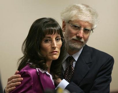 Robert Raich embraces his wife, Angel, Monday, June 6, 2005, at a news conference in Oakland, Calif. Angel Raich is one of two persons that sued then-U.S. Attorney General John Ashcroft, asking for a court order letting them smoke, grow or obtain marijuana without fear of arrest, home raids or other intrusion by federal authorities. The Supreme Court ruled Monday, that federal authorities may prosecute sick people whose doctors prescribe marijuana to ease pain, concluding that state laws don't protect users from a federal ban on the drug. (AP