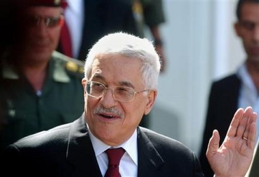 Palestinian Authority President Mahmoud Abbas, right, also known as Abu Mazen, leaves his office in the West Bank town of Ramallah on his way to the Gaza Strip, Wednesday June 8, 2005.