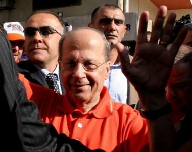 Lebanon's anti-Syrian Christian leader Michel Aoun waves at a polling station in Beirut's suburbs June 12, 2005. 